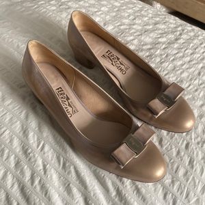 Ferragamo gold patent pumps